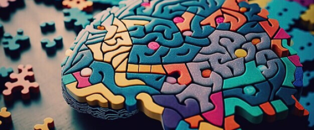 brain made of multicoloured puzzle pieces